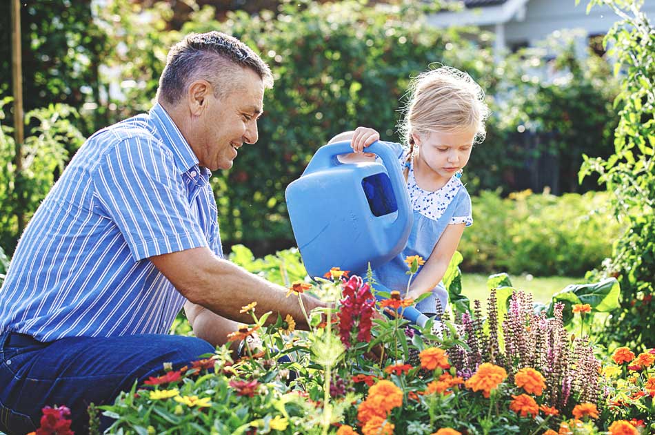A father & daughter plant flowers to improve their home's appeal before a mortgage refinance
